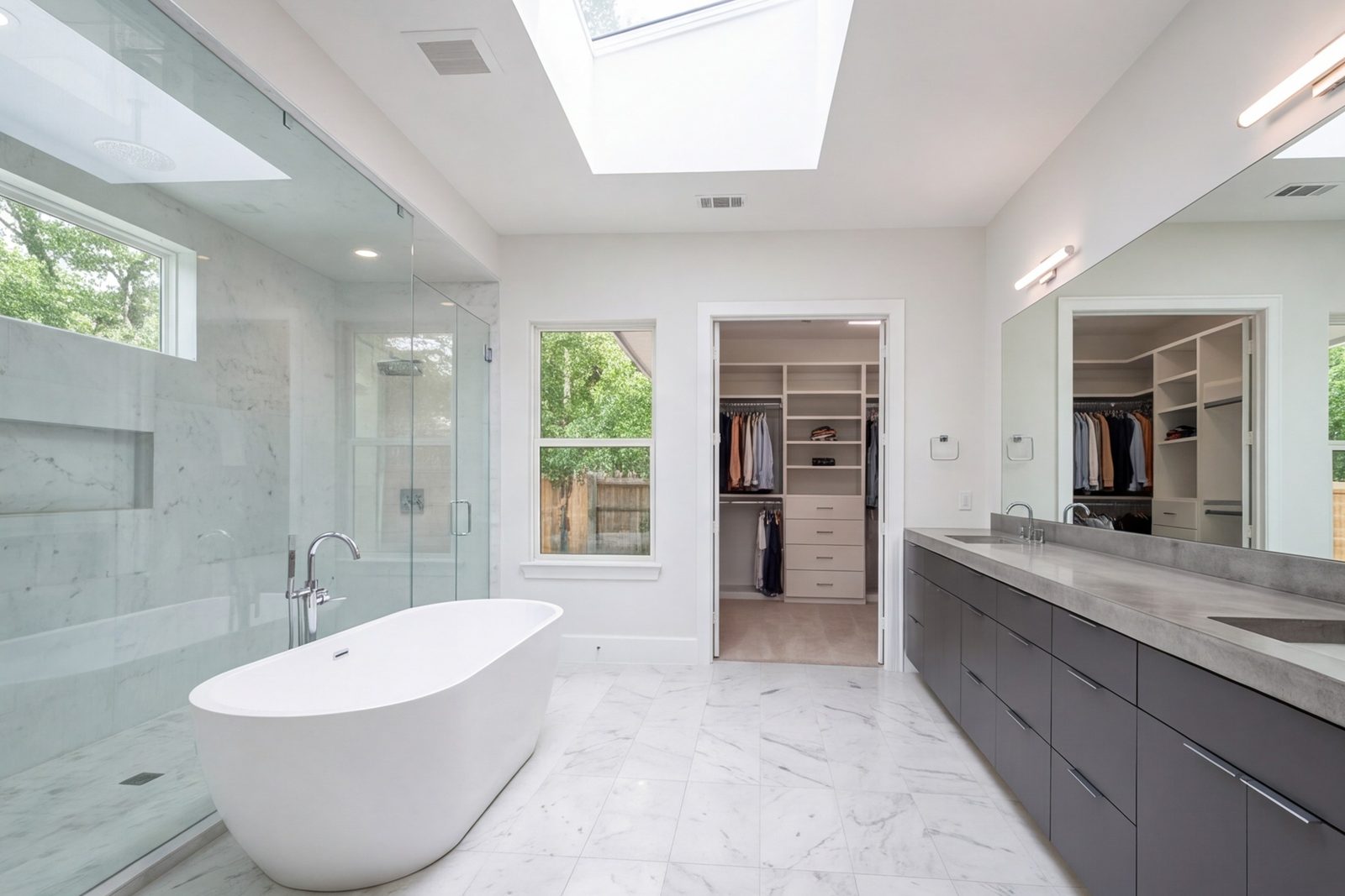 Memorial primary suite with bath and walk-in closet in a bright, modern layout